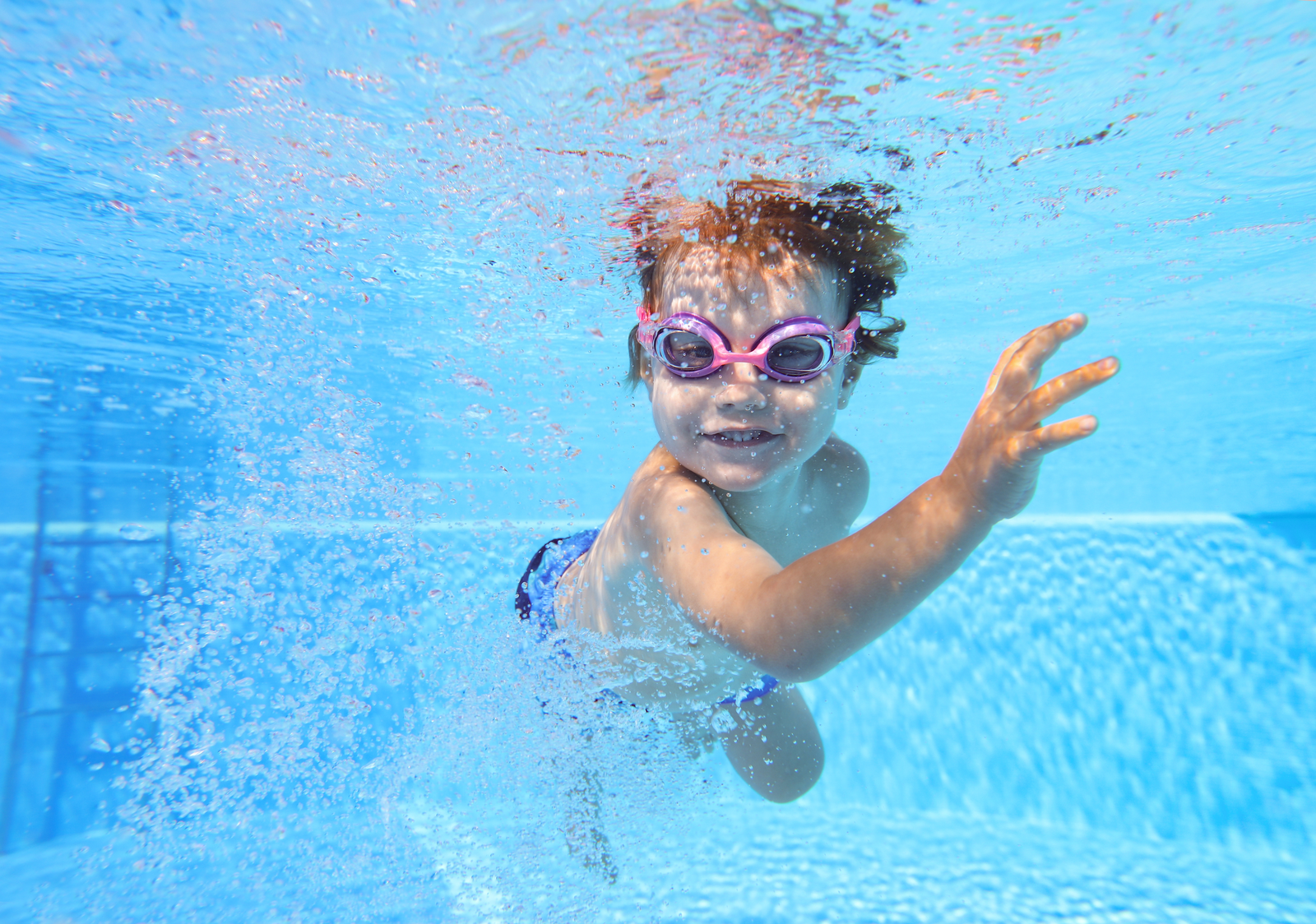 child swimming underwater