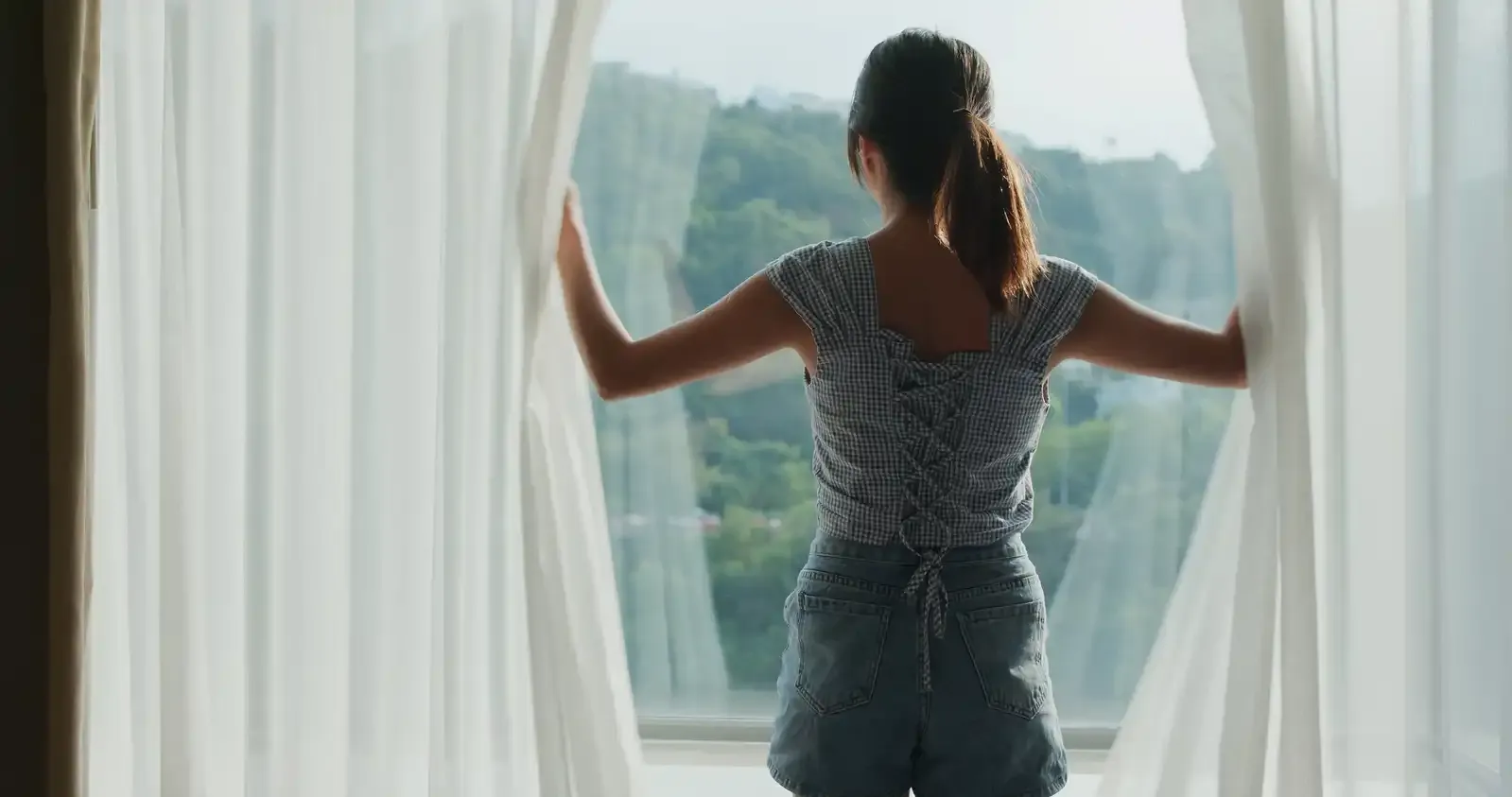 person looking at condo rental window overlooking gatlinburg